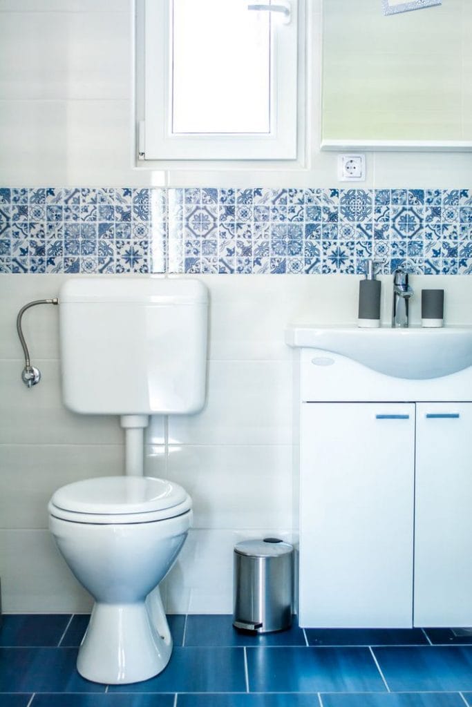 Apartment in Bovec town that has a sparkling clean white toilet and a white sink.