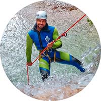 A fit man has a safe and thrilling first-time rappelling experience while canyoning in Soča river valley.