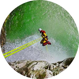 Canyoning guide performing a thrilling rappel down the waterfall in Fratarica creek. Click to see more canyons.