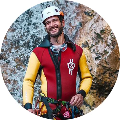 Head guide at Canyoning Challenge smiling to the camera man.